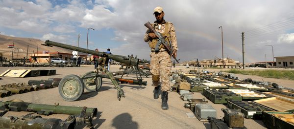 (File) A Syrian Army soldier holds his weapon, as he walks next to others that belonged to rebels from Eastern Qalamoun, after they handed them over, at the town of Dumayr, Damascus, Syria April 22, 2018 - Sputnik International