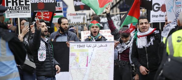 (File) Protesters hold up a map along with Palestinian flags and placards during a demonstration on Whitehall opposite Downing Street in central London on April 7, 2018 in support of the Palestianians in the Gaza Strip (File) Protesters hold up a map along with Palestinian flags and placards during a demonstration on Whitehall opposite Downing Street in central London on April 7, 2018 in support of the Palestianians in the Gaza Strip - Sputnik International
