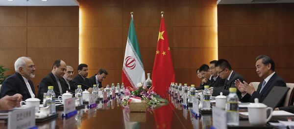Chinese Foreign Minister Wang Yi, right, and Iranian Foreign Minister Mohammad Javad Zarif, left, attend a bilateral meeting Tuesday, Sept. 15, 2015 in Beijing, China Chinese Foreign Minister Wang Yi, right, and Iranian Foreign Minister Mohammad Javad Zarif, left, attend a bilateral meeting Tuesday, Sept. 15, 2015 in Beijing, China - Sputnik International