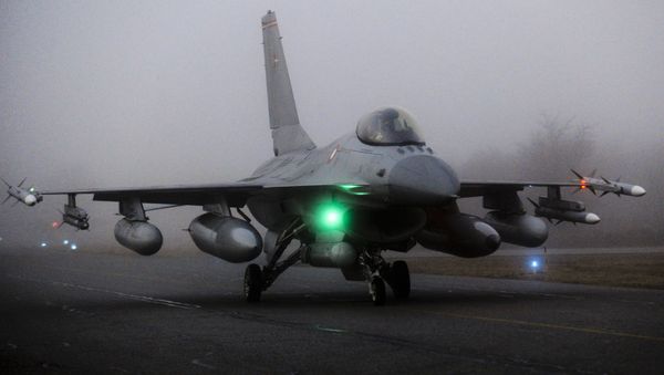 An F16 aircraft fighter is ready to take off from the Danish military base Fighter Wing Skrydstryp in Jutland early March 19, 2011 An F16 aircraft fighter is ready to take off from the Danish military base Fighter Wing Skrydstryp in Jutland early March 19, 2011 - Sputnik International