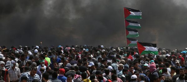 Palestinian demonstrators gather during a protest against U.S. embassy move to Jerusalem and ahead of the 70th anniversary of Nakba, at the Israel-Gaza border in the southern Gaza Strip May 14, 2018 - Sputnik International