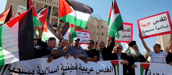 Palestinians, among them Adnan Husseini (3-rd R), the Palestinian Authority-appointed mayor of Jerusalem, participate in protest against the opening of the new U.S. embassy in Jerusalem, in Jerusalem May 14, 2018. Banner reads in Arabic Jerusalem Arab, Palestinian, Islamic and Christian and No to the Moving of the American Embassy. Palestinians, among them Adnan Husseini (3-rd R), the Palestinian Authority-appointed mayor of Jerusalem, participate in protest against the opening of the new U.S. embassy in Jerusalem, in Jerusalem May 14, 2018. Banner reads in Arabic Jerusalem Arab, Palestinian, Islamic and Christian and No to the Moving of the American Embassy. - Sputnik International