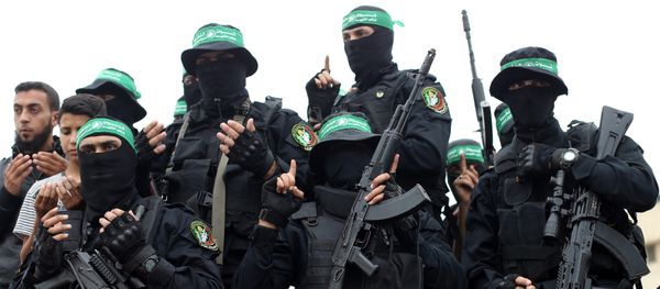 Palestinian Hamas militants attend the funeral of their comrades who were killed in an explosion, in the central Gaza Strip May 6, 2018 Palestinian Hamas militants attend the funeral of their comrades who were killed in an explosion, in the central Gaza Strip May 6, 2018 - Sputnik International