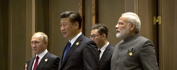 (L to R) Russian President Vladimir Putin, Chinese President Xi Jinping and Indian Prime Minister Narendra Modi arrive for the Dialogue of Emerging Market and Developing Countries on the sidelines of the 2017 BRICS Summit in Xiamen, southeastern China's Fujian Province on September 5, 2017 - Sputnik International