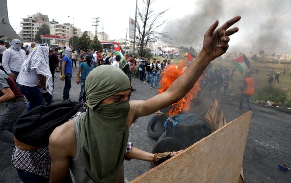 A Palestinian demonstrator gestures during a protest marking the 70th anniversary of Nakba, near the Jewish settlement of Beit El, near Ramallah, in the occupied West Bank May 15, 2018 A Palestinian demonstrator gestures during a protest marking the 70th anniversary of Nakba, near the Jewish settlement of Beit El, near Ramallah, in the occupied West Bank May 15, 2018 - Sputnik International