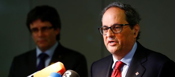 Newly elected regional leader of Catalonia Quim Torra (R) and his predecessor Carles Puigdemont attend a news conference in Berlin, Germany May 15, 2018 Newly elected regional leader of Catalonia Quim Torra (R) and his predecessor Carles Puigdemont attend a news conference in Berlin, Germany May 15, 2018 - Sputnik International