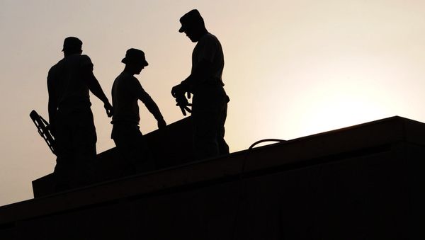 workers on a construction site - Sputnik International