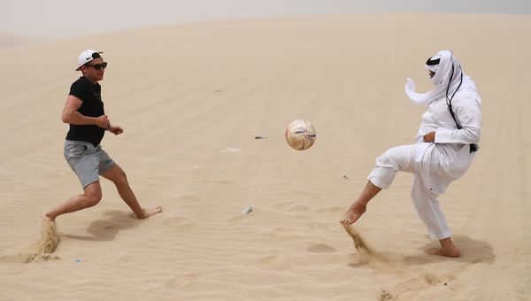 Playing football in the desert of Khor Al Adaid, Doha, State of Qatar. - Sputnik International