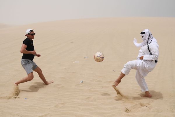 Playing football in the desert of Khor Al Adaid, Doha, Qatar. Playing football in the desert of Khor Al Adaid, Doha, Qatar. - Sputnik International