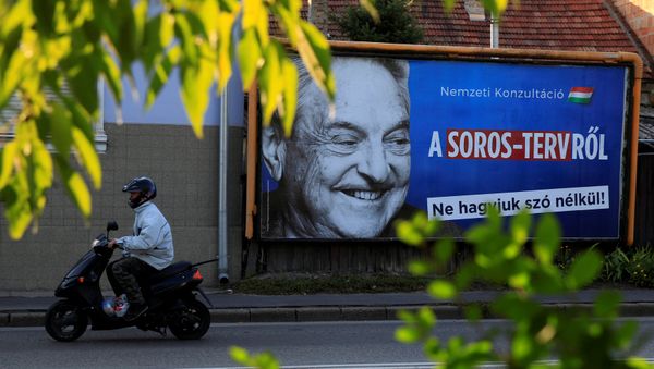 A man rides his moped past a government billboard displaying George Soros in monochrome next to a message urging Hungarians to take part in a national consultation about what it calls a plan by the Hungarian-born financier to settle a million migrants in Europe per year, in Szolnok, Hungary, October 2, 2017 - Sputnik International