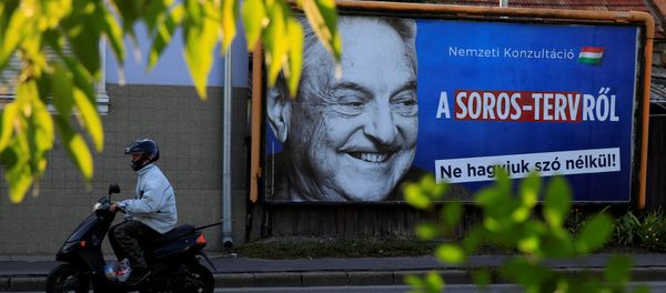 A man rides his moped past a government billboard displaying George Soros in monochrome next to a message urging Hungarians to take part in a national consultation about what it calls a plan by the Hungarian-born financier to settle a million migrants in Europe per year, in Szolnok, Hungary, October 2, 2017 A man rides his moped past a government billboard displaying George Soros in monochrome next to a message urging Hungarians to take part in a national consultation about what it calls a plan by the Hungarian-born financier to settle a million migrants in Europe per year, in Szolnok, Hungary, October 2, 2017 - Sputnik International