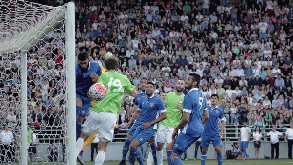 Abkhazia (in the green) taking on Panjab in the 2016 Conifa World Cup final - Sputnik International