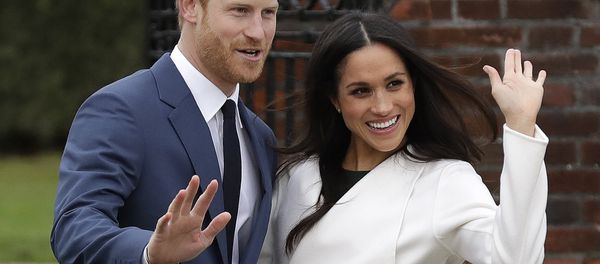 Britain's Prince Harry and his fiancee Meghan Markle pose for photographers during a photocall in the grounds of Kensington Palace in London, Monday Nov. 27, 2017 Britain's Prince Harry and his fiancee Meghan Markle pose for photographers during a photocall in the grounds of Kensington Palace in London, Monday Nov. 27, 2017 - Sputnik International