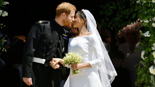 Prince Harry and Meghan Markle kiss on the steps of St George's Chapel in Windsor Castle after their wedding in Windsor, Britain, May 19, 2018 - Sputnik International