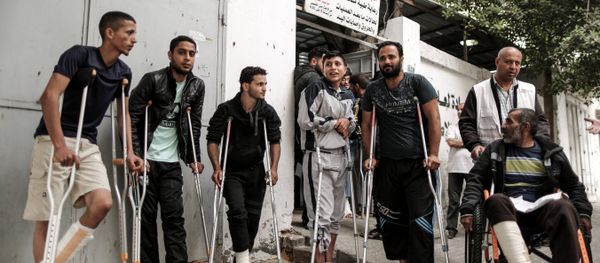 Palestinians, wounded in previous weeks during mass protests against Israeli forces along the border of the Palestinian enclave, dubbed The Great March of Return, await medical check-up at the Doctors Without Borders (MSF) clinic in Gaza City (File) Palestinians, wounded in previous weeks during mass protests against Israeli forces along the border of the Palestinian enclave, dubbed The Great March of Return, await medical check-up at the Doctors Without Borders (MSF) clinic in Gaza City (File) - Sputnik International