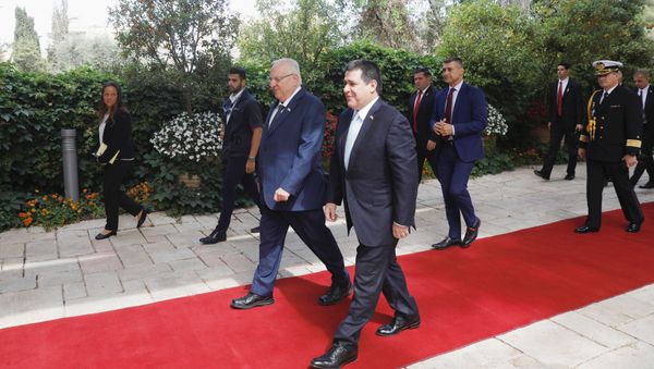 Paraguayan President Horacio Cartes walks next to Israeli President Reuven Rivlin upon his arrival for a meeting at the Israeli president's residence in Jerusalem, ahead of the dedication ceremony of the embassy of Paraguay in Jerusalem, May 21, 2018 - Sputnik International