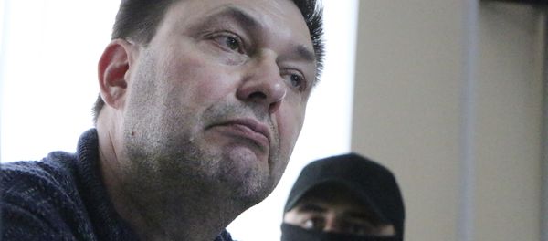 Kirill Vyshinskiy, bureau chief of RIA Novosti news agency in Ukraine, listens to lawyer in a court room in Kherson, Ukraine, Thursday, May 17, 2018 Kirill Vyshinskiy, bureau chief of RIA Novosti news agency in Ukraine, listens to lawyer in a court room in Kherson, Ukraine, Thursday, May 17, 2018 - Sputnik International