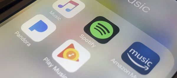 This Sunday, Jan. 28, 2018, photo shows music streaming apps clockwise from top left, Apple, Spotify, Amazon, Pandora and Google on an iPhone in New York. A federal copyright board has raised the music streaming royalties for songwriters and music publishers by more than 40 percent. The decision announced earlier this weekend stems from a dispute pitting songwriters against steadily growing music streaming services sold by Spotify, Apple, Google, Amazon and Pandora.  - Sputnik International
