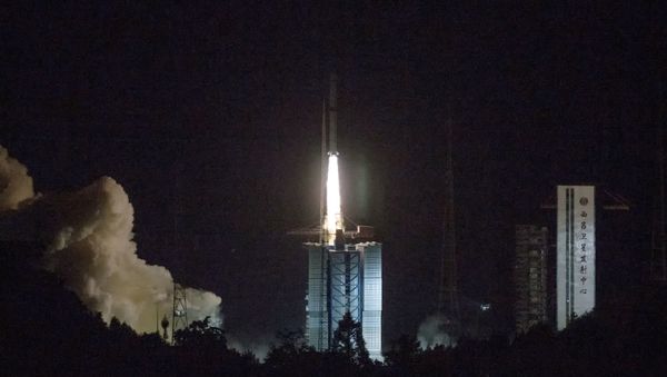 In this photo provided by China's official Xinhua News Agency, a Long March-4C rocket carrying a relay satellite, named Queqiao (Magpie Bridge), is launched from southwest China's Xichang Satellite Launch Center, Monday, May 21, 2018. China has launched a relay satellite as part of a groundbreaking program to land a probe on the far side of the moon this year. The China National Space Administration said on its website that the satellite lofted into space early Monday aboard a Long March-4C rocket will facilitate communication between controllers on Earth and the Chang'e 4 mission. - Sputnik International