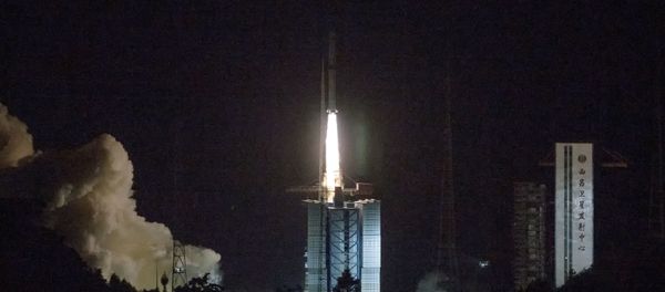 In this photo provided by China's official Xinhua News Agency, a Long March-4C rocket carrying a relay satellite, named Queqiao (Magpie Bridge), is launched from southwest China's Xichang Satellite Launch Center, Monday, May 21, 2018. China has launched a relay satellite as part of a groundbreaking program to land a probe on the far side of the moon this year. The China National Space Administration said on its website that the satellite lofted into space early Monday aboard a Long March-4C rocket will facilitate communication between controllers on Earth and the Chang'e 4 mission. In this photo provided by China's official Xinhua News Agency, a Long March-4C rocket carrying a relay satellite, named Queqiao (Magpie Bridge), is launched from southwest China's Xichang Satellite Launch Center, Monday, May 21, 2018. China has launched a relay satellite as part of a groundbreaking program to land a probe on the far side of the moon this year. The China National Space Administration said on its website that the satellite lofted into space early Monday aboard a Long March-4C rocket will facilitate communication between controllers on Earth and the Chang'e 4 mission. - Sputnik International