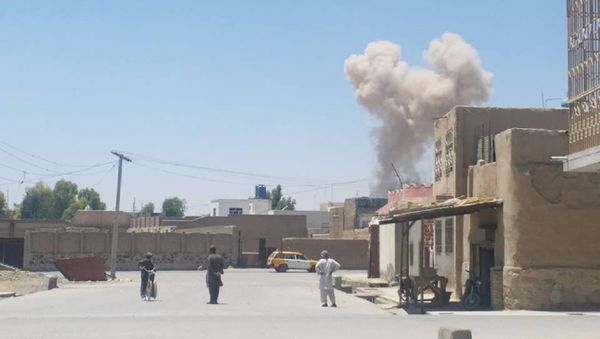 A cloud of smoke is seen after an explosion in Kandahar, Afghanistan May 22, 2018 in this picture obtained from social media A cloud of smoke is seen after an explosion in Kandahar, Afghanistan May 22, 2018 in this picture obtained from social media - Sputnik International