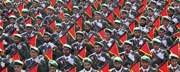 In this Sept. 21, 2016 file photo, Iran's Revolutionary Guard troops march in a military parade marking the 36th anniversary of Iraq's 1980 invasion of Iran, in front of the shrine of late revolutionary founder Ayatollah Khomeini, just outside Tehran, Iran In this Sept. 21, 2016 file photo, Iran's Revolutionary Guard troops march in a military parade marking the 36th anniversary of Iraq's 1980 invasion of Iran, in front of the shrine of late revolutionary founder Ayatollah Khomeini, just outside Tehran, Iran - Sputnik International