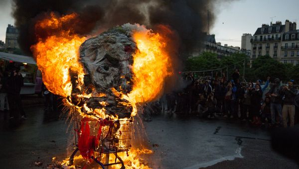 Rallies in Paris on the national protest day by French civil servants against French President Emmanuel Macron's economic reforms Rallies in Paris on the national protest day by French civil servants against French President Emmanuel Macron's economic reforms - Sputnik International