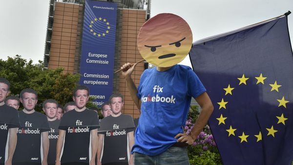 Global activists of Avaaz, set up cardboard cutouts of Facebook chief Mark Zuckerberg, on which is written Fix Fakebook, in front of the European Union headquarters in Brussels, on May 22, 2018, as they call attention to what the groups says are hundreds of millions of fake accounts still spreading disinformation on Facebook. Global activists of Avaaz, set up cardboard cutouts of Facebook chief Mark Zuckerberg, on which is written Fix Fakebook, in front of the European Union headquarters in Brussels, on May 22, 2018, as they call attention to what the groups says are hundreds of millions of fake accounts still spreading disinformation on Facebook. - Sputnik International