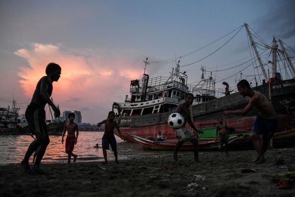 Children play soccer by the Yangon River in Myanmar Children play soccer by the Yangon River in Myanmar - Sputnik International