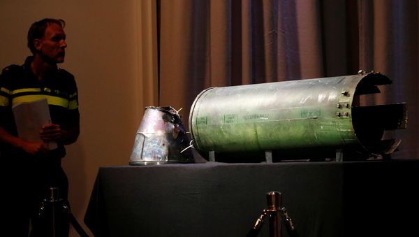 A damaged missile is displayed during a news conference by members of the Joint Investigation Team, comprising the authorities from Australia, Belgium, Malaysia, the Netherlands and Ukraine, who present interim results in the ongoing investigation of the 2014 MH17 crash that killed 298 people over eastern Ukraine, in Bunnik, Netherlands, May 24, 2018 A damaged missile is displayed during a news conference by members of the Joint Investigation Team, comprising the authorities from Australia, Belgium, Malaysia, the Netherlands and Ukraine, who present interim results in the ongoing investigation of the 2014 MH17 crash that killed 298 people over eastern Ukraine, in Bunnik, Netherlands, May 24, 2018 - Sputnik International