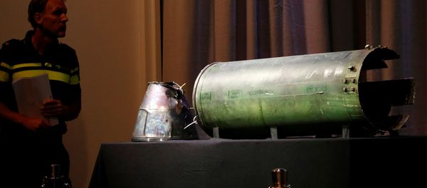 A damaged missile is displayed during a news conference by members of the Joint Investigation Team, comprising the authorities from Australia, Belgium, Malaysia, the Netherlands and Ukraine, who present interim results in the ongoing investigation of the 2014 MH17 crash that killed 298 people over eastern Ukraine, in Bunnik, Netherlands, May 24, 2018 A damaged missile is displayed during a news conference by members of the Joint Investigation Team, comprising the authorities from Australia, Belgium, Malaysia, the Netherlands and Ukraine, who present interim results in the ongoing investigation of the 2014 MH17 crash that killed 298 people over eastern Ukraine, in Bunnik, Netherlands, May 24, 2018 - Sputnik International