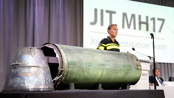 A damaged missile is displayed during a news conference by members of the Joint Investigation Team, comprising the authorities from Australia, Belgium, Malaysia, the Netherlands and Ukraine who present interim results in the ongoing investigation of the 2014 MH17 crash that killed 298 people over eastern Ukraine, in Bunnik, Netherlands, May 24, 2018 A damaged missile is displayed during a news conference by members of the Joint Investigation Team, comprising the authorities from Australia, Belgium, Malaysia, the Netherlands and Ukraine who present interim results in the ongoing investigation of the 2014 MH17 crash that killed 298 people over eastern Ukraine, in Bunnik, Netherlands, May 24, 2018 - Sputnik International