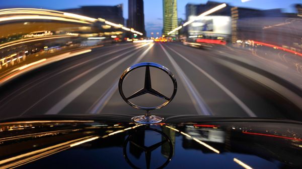 The star emblem on the hood of a driving Mercedes-Benz is seen near Potsdam Square, Potsdamer Platz, in Berlin - Sputnik International