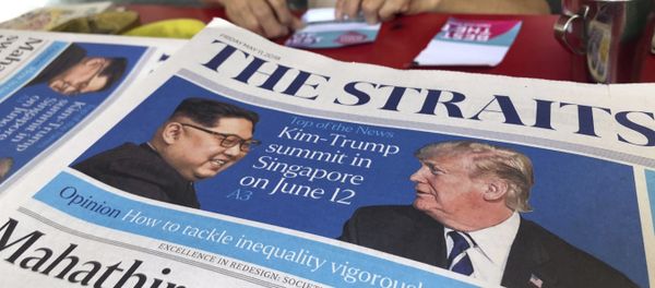 FILE - In this May 11, 2018, file photo, a news vendor counts her money near a stack of newspapers with a photo of U.S. President Donald Trump, right, and North Korea's leader Kim Jong Un on its front page in Singapore. FILE - In this May 11, 2018, file photo, a news vendor counts her money near a stack of newspapers with a photo of U.S. President Donald Trump, right, and North Korea's leader Kim Jong Un on its front page in Singapore. - Sputnik International