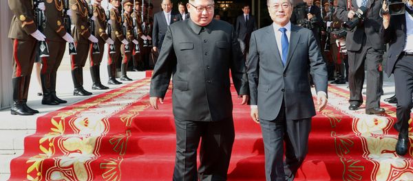 South Korean President Moon Jae-in and North Korean leader Kim Jong Un leave after their summit at the truce village of Panmunjom, North Korea, in this handout picture provided by the Presidential Blue House on May 26, 2018. Picture taken on May 26, 2018 - Sputnik International