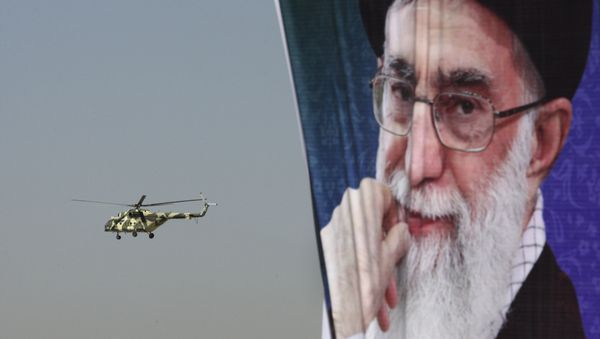 A police helicopter flies behind a poster of Iranian supreme leader Ayatollah Ali Khamenei A police helicopter flies behind a poster of Iranian supreme leader Ayatollah Ali Khamenei - Sputnik International