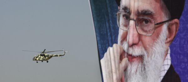 A police helicopter flies behind a poster of Iranian supreme leader Ayatollah Ali Khamenei A police helicopter flies behind a poster of Iranian supreme leader Ayatollah Ali Khamenei - Sputnik International