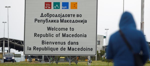 A person walks near a sign that reads welcome to Macedonia at the Macedonia-Greece border April 16, 2018 - Sputnik International