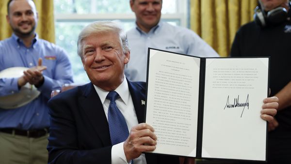 President Donald Trump holds up a National Manufacturing Day Proclamation after signing it in the Oval Office of the White House in Washington, Friday, Oct. 6, 2017 President Donald Trump holds up a National Manufacturing Day Proclamation after signing it in the Oval Office of the White House in Washington, Friday, Oct. 6, 2017 - Sputnik International