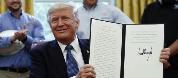 President Donald Trump holds up a National Manufacturing Day Proclamation after signing it in the Oval Office of the White House in Washington, Friday, Oct. 6, 2017 President Donald Trump holds up a National Manufacturing Day Proclamation after signing it in the Oval Office of the White House in Washington, Friday, Oct. 6, 2017 - Sputnik International