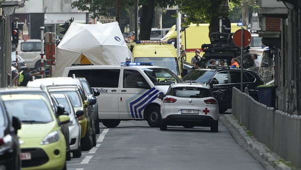 Police and ambulance are seen at the site where an armed man shot and killed police officers before being subdued by police in the eastern Belgian city of Liege on May 29, 2018 Police and ambulance are seen at the site where an armed man shot and killed police officers before being subdued by police in the eastern Belgian city of Liege on May 29, 2018 - Sputnik International