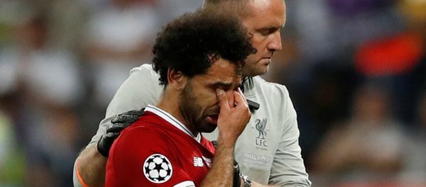 Soccer Football - Champions League Final - Real Madrid v Liverpool - NSC Olympic Stadium, Kiev, Ukraine - May 26, 2018 Liverpool's Mohamed Salah looks dejected as he is substituted off due to injury Soccer Football - Champions League Final - Real Madrid v Liverpool - NSC Olympic Stadium, Kiev, Ukraine - May 26, 2018 Liverpool's Mohamed Salah looks dejected as he is substituted off due to injury - Sputnik International
