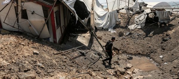 A man inspects the damage at a site targeted by an Israeli air strike a day before in Khan Younis in the southern Gaza strip on May 30, 2018 A man inspects the damage at a site targeted by an Israeli air strike a day before in Khan Younis in the southern Gaza strip on May 30, 2018 - Sputnik International
