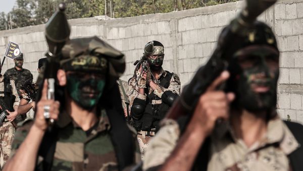 Members of the Palestinian Islamic Jihad movement march with rocket-propelled grenade (RPG) launchers during a military drill in Khan Yunis in the southern Gaza Strip March 27, 2018 - Sputnik International