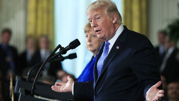 President Donald Trump with German Chancellor Angela Merkel speaks during a news conference in the East Room of the White House in Washington, Friday, April 27, 2018 - Sputnik International