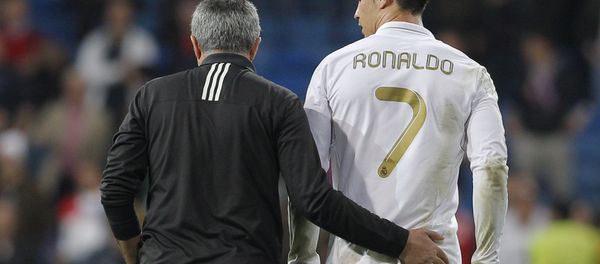 Real Madrid's coach Jose Mourinho from Portugal embraces Cristiano Ronaldo from Portugal after a Champions League round of 16, second leg soccer match against CSKA Moscow's at the Santiago Bernabeu Stadium, in Madrid, Wednesday, March 14, 2012 Real Madrid's coach Jose Mourinho from Portugal embraces Cristiano Ronaldo from Portugal after a Champions League round of 16, second leg soccer match against CSKA Moscow's at the Santiago Bernabeu Stadium, in Madrid, Wednesday, March 14, 2012 - Sputnik International
