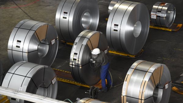 FILES) In this file photo taken on March 17, 2015 a worker packs coils for delivery at the production site of a German steel company in Salzgitter. Imposed stiff tariffs by the United States on European, Mexican and Canadian steel and aluminium, that have come into effect on June 1, 2018 - Sputnik International