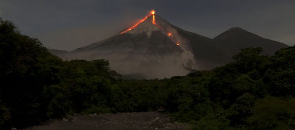 In this image taken with a long exposure, the Volcan de Fuego, or Volcano of Fire, spews hot molten lava from its crater in San Juan Alotenango, Guatemala, Wednesday, July 1, 2015 - Sputnik International