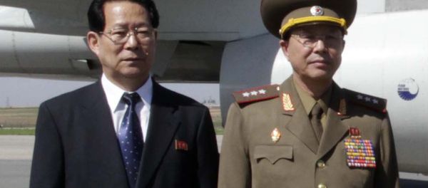 Ri Yong Gil, right, poses at Pyongyang Airport in 2013. Ri Yong Gil, right, poses at Pyongyang Airport in 2013. - Sputnik International