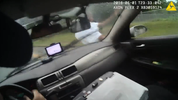 Bodycam footage shows an officer with Georgia's Athens-Clarke County Police Department ram a suspect with his police cruiser. - Sputnik International